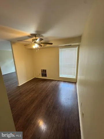 a view of a livingroom with wooden floor