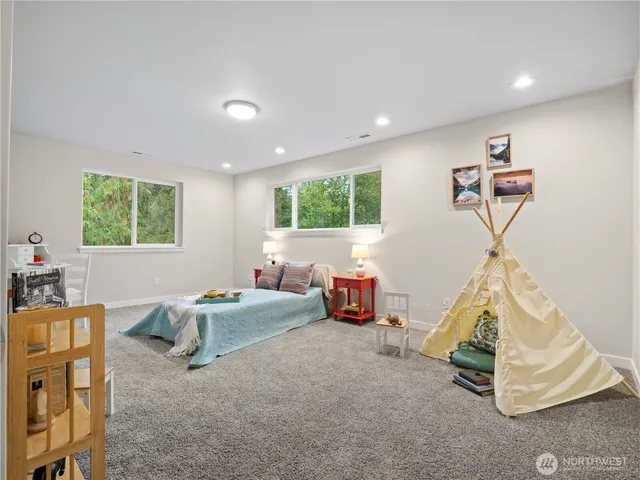 a bedroom with furniture and a window