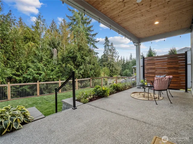 a view of a porch with furniture and garden