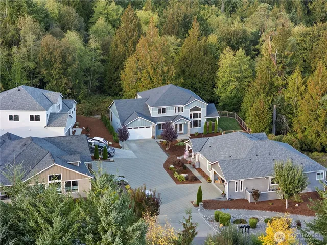 an aerial view of a house with swimming pool