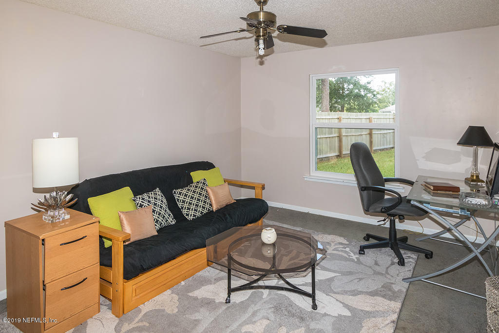 11012 Reading Road Jacksonville, FL 32257 - Photo 20 of 29 a living room with furniture and a window
