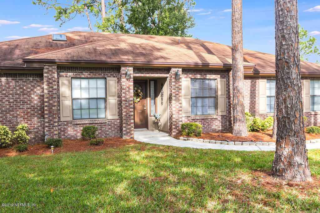 11012 Reading Road Jacksonville, FL 32257 - Photo 2 of 29 a front view of a house with a yard