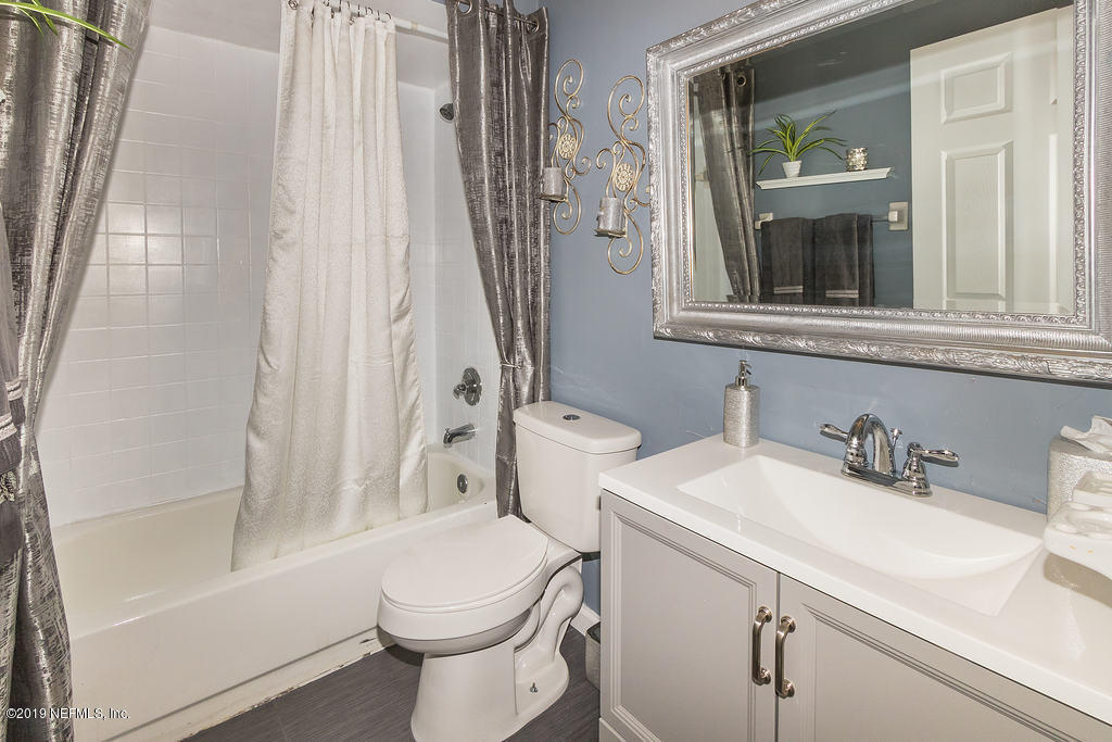 11012 Reading Road Jacksonville, FL 32257 - Photo 21 of 29 a bathroom with a sink toilet and shower