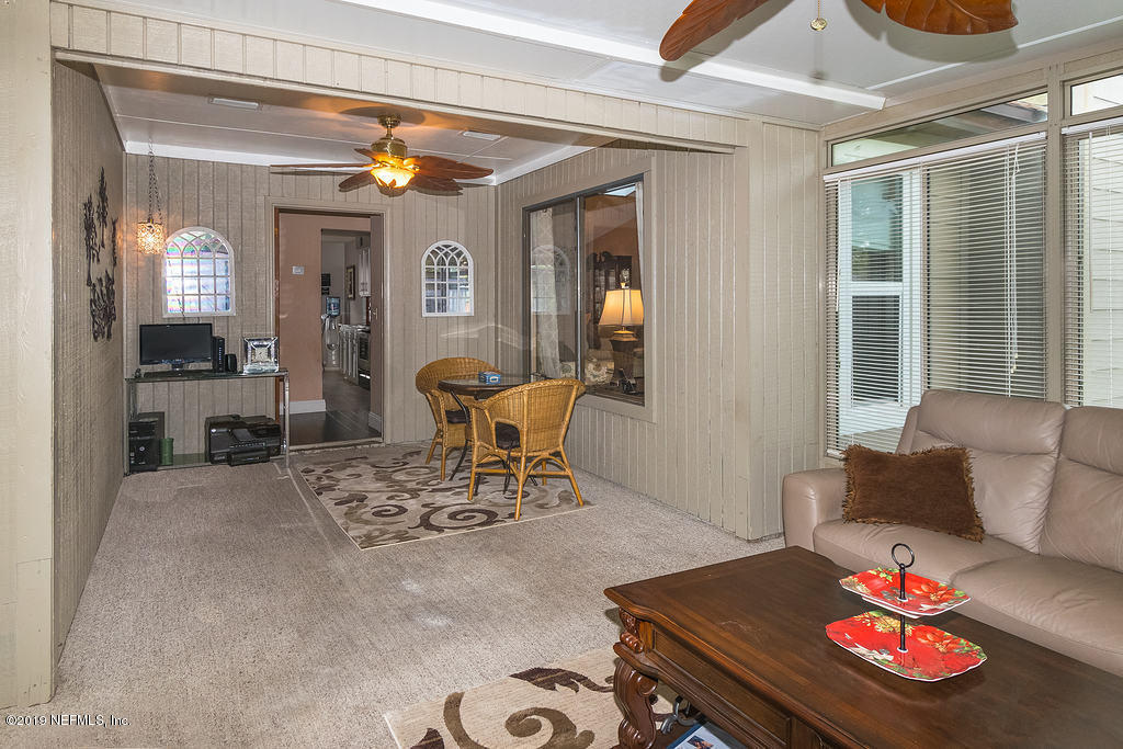 11012 Reading Road Jacksonville, FL 32257 - Photo 24 of 29 a living room with furniture and a table