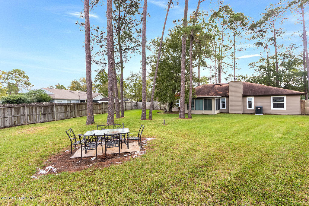 11012 Reading Road Jacksonville, FL 32257 - Photo 26 of 29 a view of a house with a backyard porch and sitting area