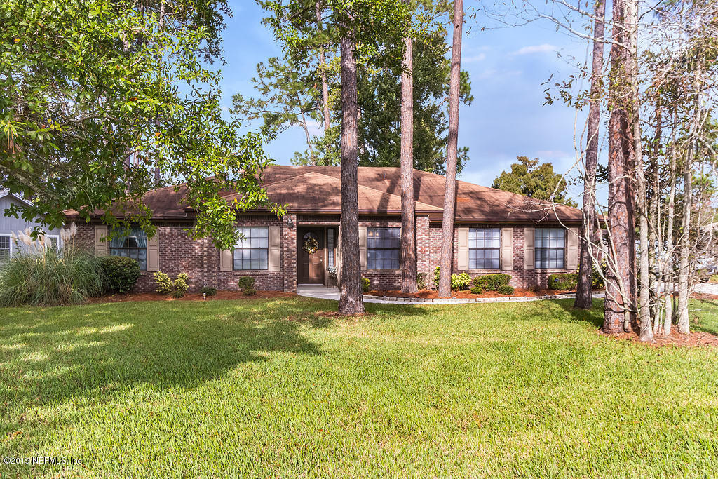 11012 Reading Road Jacksonville, FL 32257 - Photo 4 of 29 a view of a house with a big yard and large tree