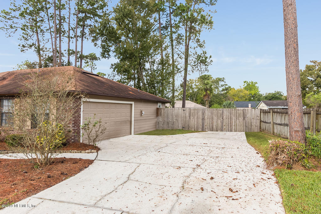 11012 Reading Road Jacksonville, FL 32257 - Photo 5 of 29 a house that has a tree in front of it