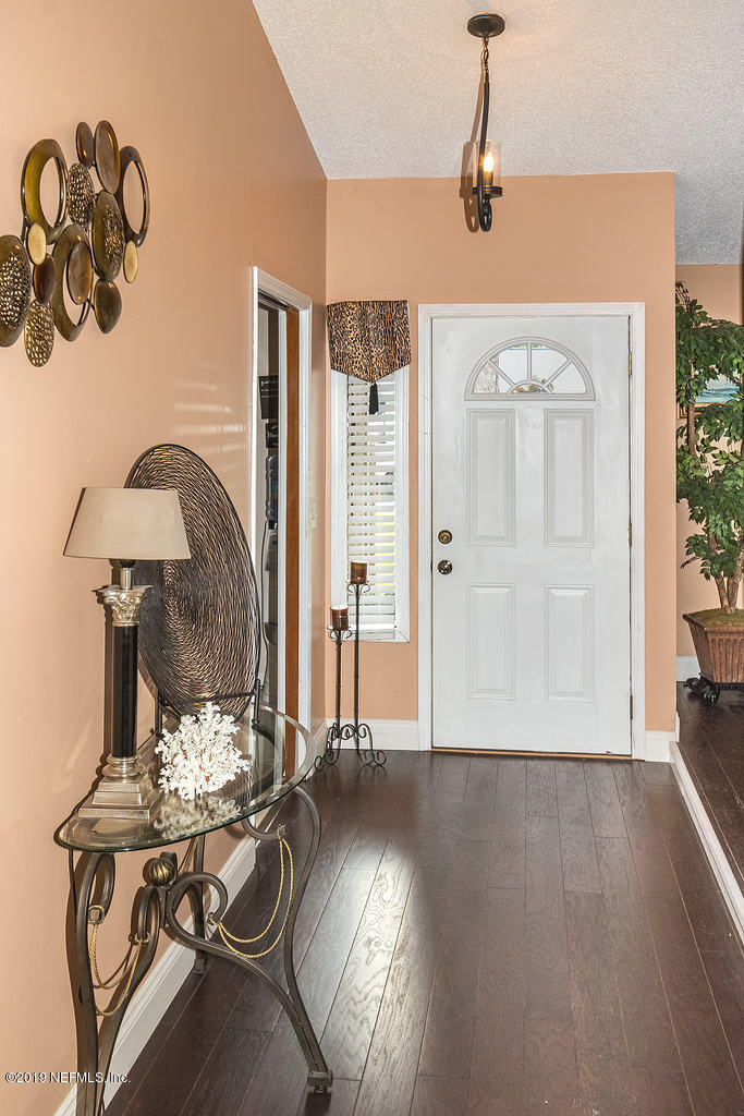 11012 Reading Road Jacksonville, FL 32257 - Photo 6 of 29 a view of a livingroom with furniture and chandelier