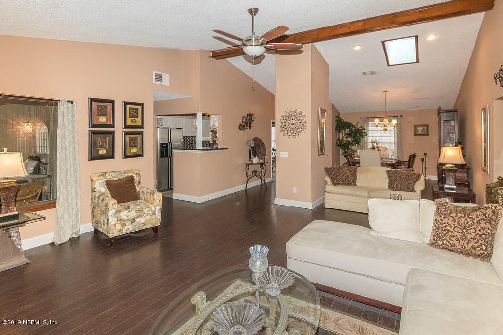 11012 Reading Road Jacksonville, FL 32257 - Photo 10 of 29 a living room with furniture and wooden floor