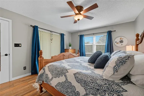 a bedroom with a large bed and a window