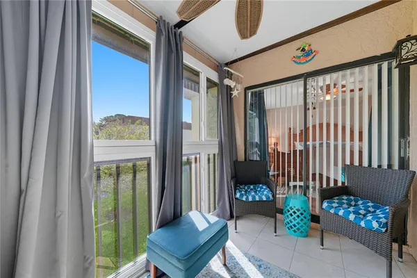 a front view of a house with outdoor seating