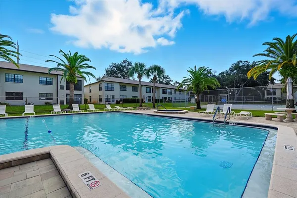 a view of swimming pool with chairs