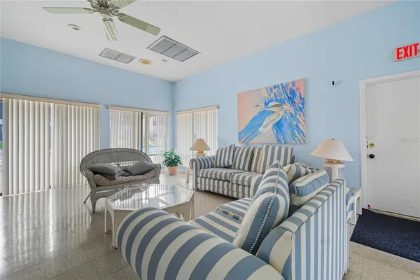 a bedroom with furniture and a chair