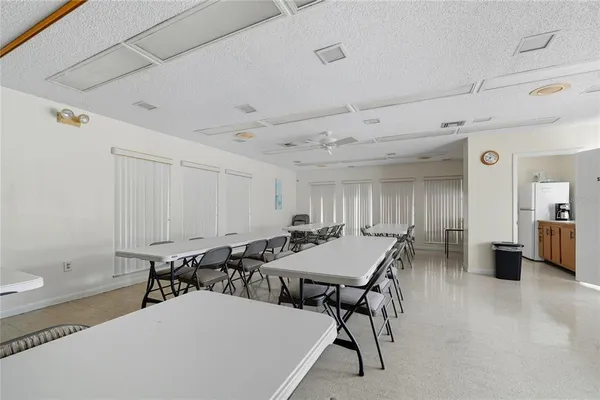a dining room with a table and chairs
