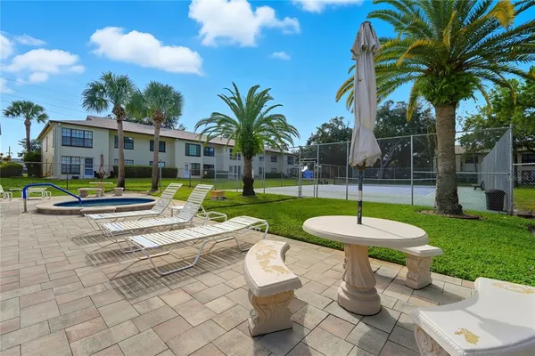a view of a backyard with a fountain