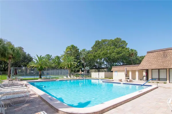 a view of a swimming pool with a patio
