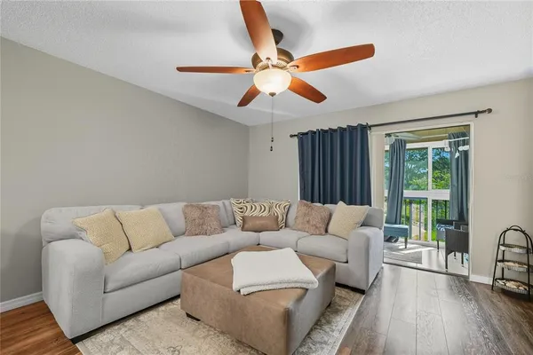 a living room with furniture and a large window