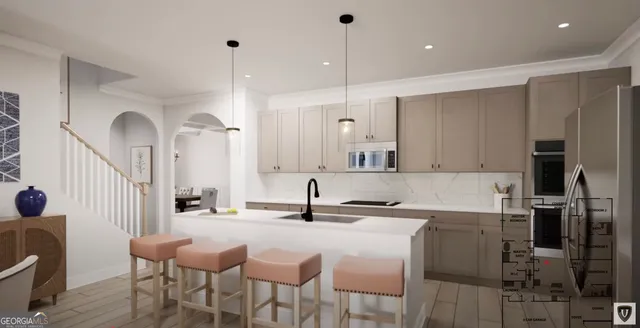 a kitchen with granite countertop a sink cabinets and stainless steel appliances