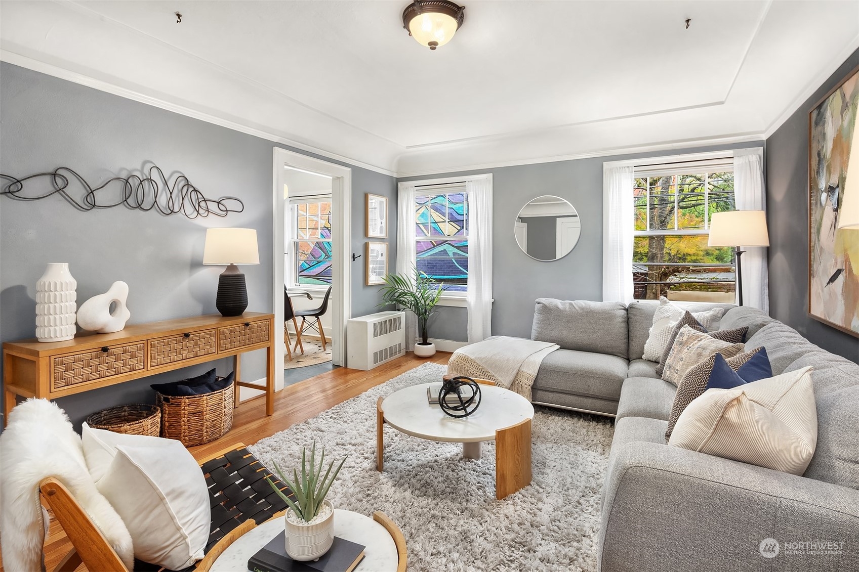 1605 East Olive Street, Unit 208 Seattle, WA 98122 - Photo 1 of 28 a living room with furniture and a large window