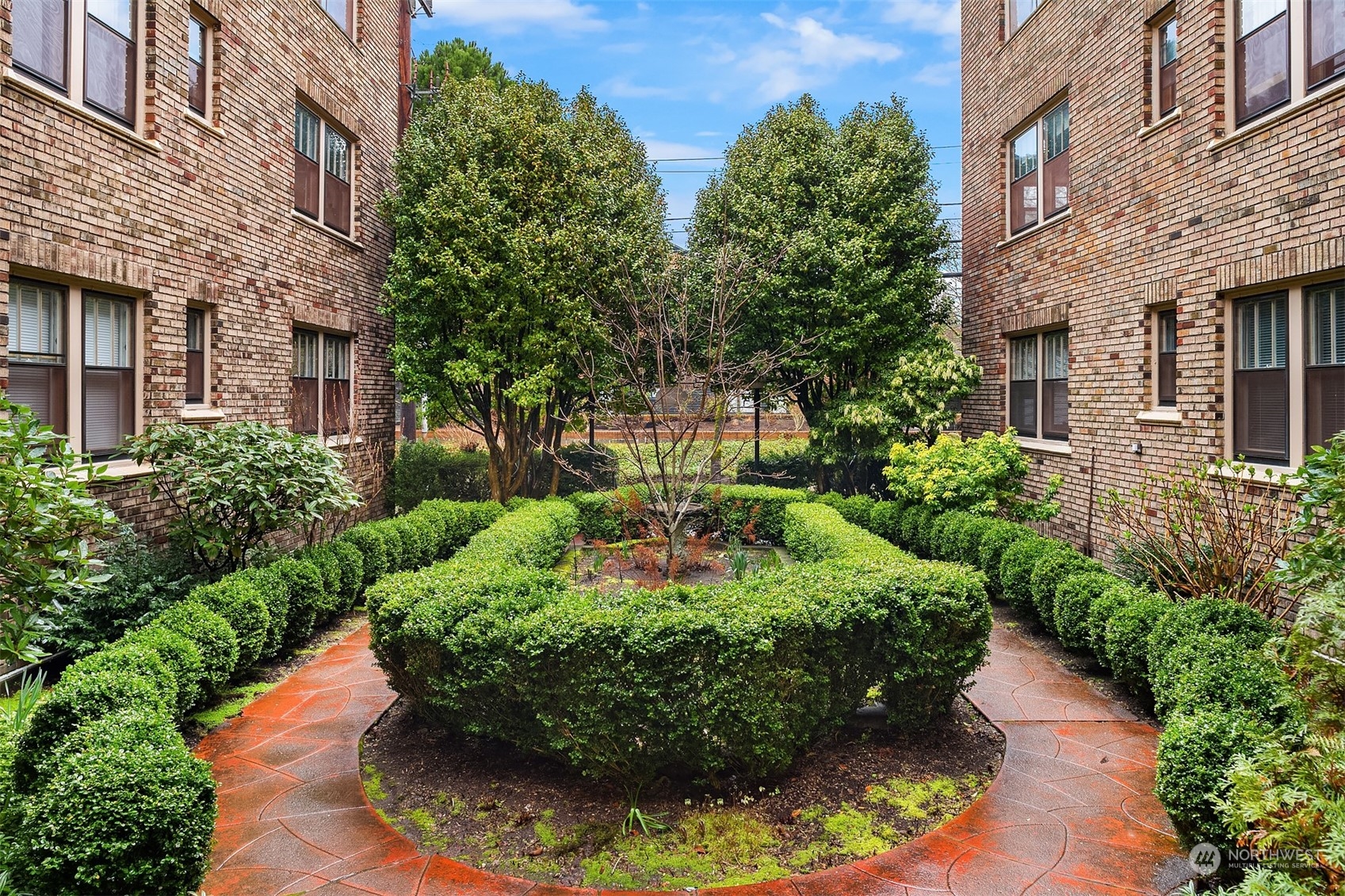1605 East Olive Street, Unit 208 Seattle, WA 98122 - Photo 26 of 28 a view of a garden with pathway