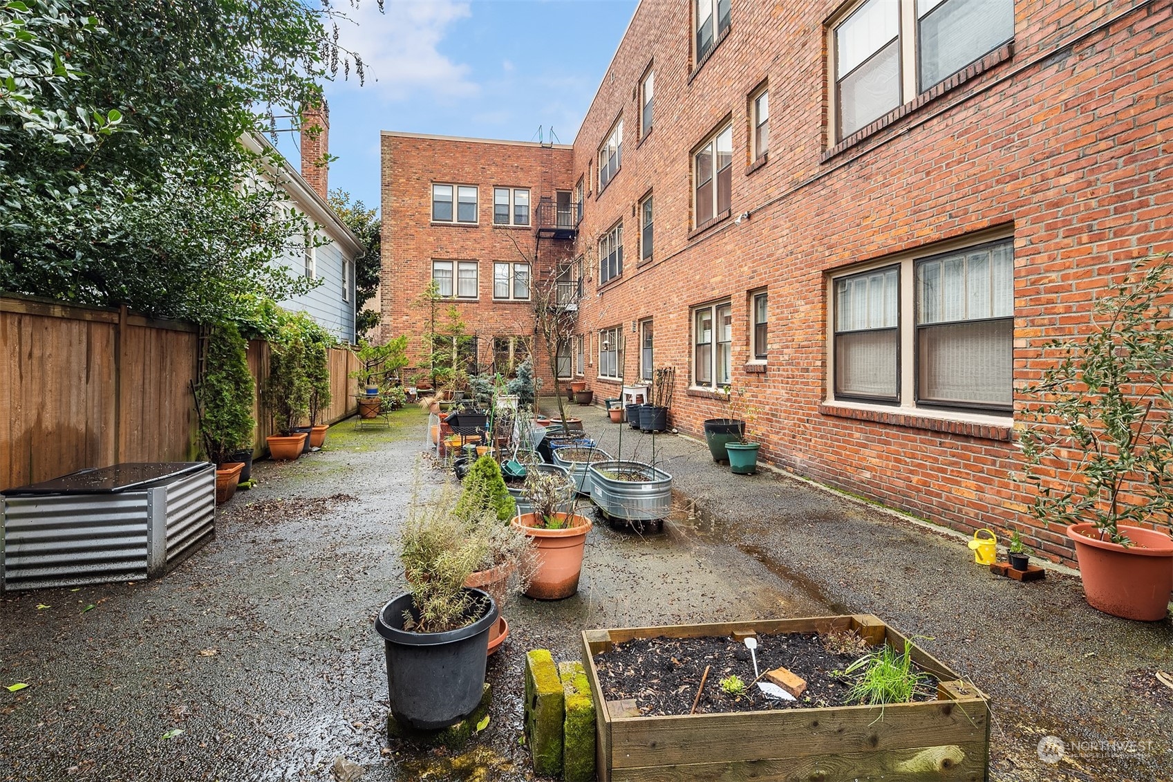 1605 East Olive Street, Unit 208 Seattle, WA 98122 - Photo 27 of 28 a backyard of a house with outdoor seating