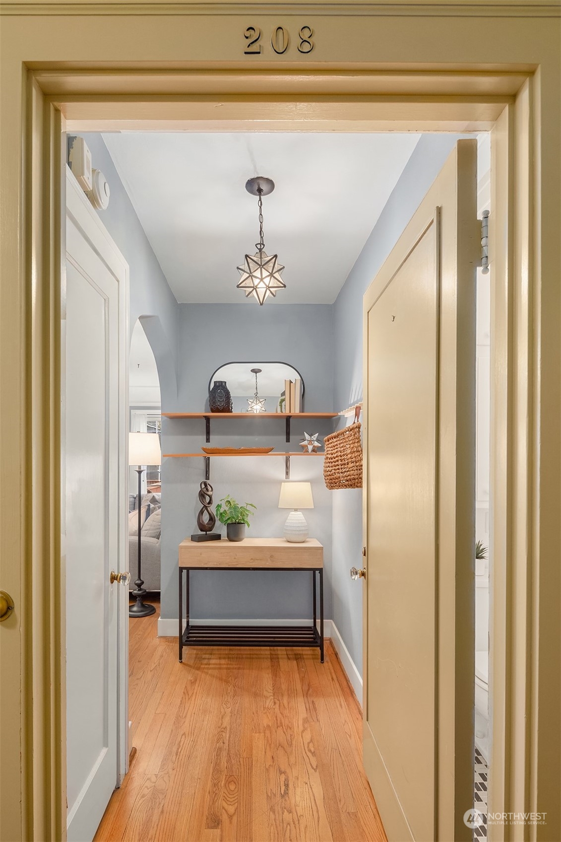 1605 East Olive Street, Unit 208 Seattle, WA 98122 - Photo 4 of 28 a view of a hallway view with staircase