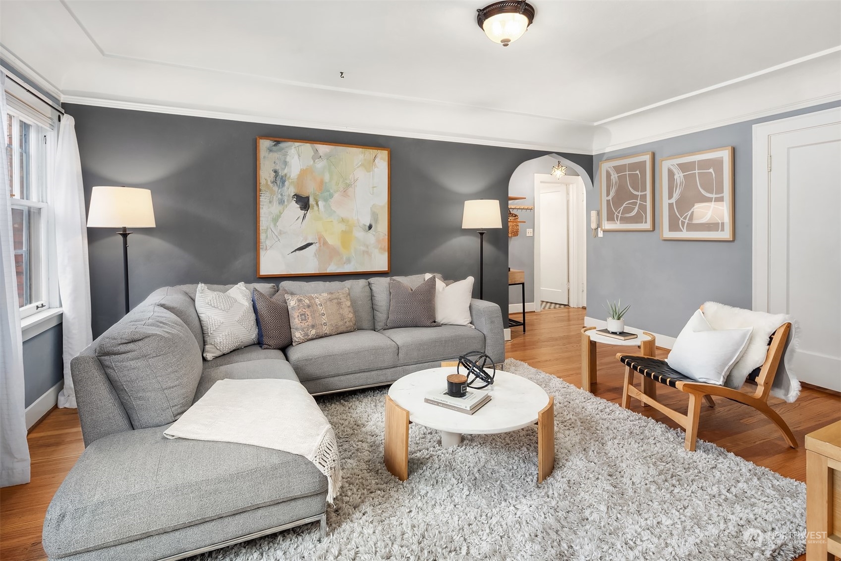 1605 East Olive Street, Unit 208 Seattle, WA 98122 - Photo 7 of 28 a living room with furniture and wooden floor