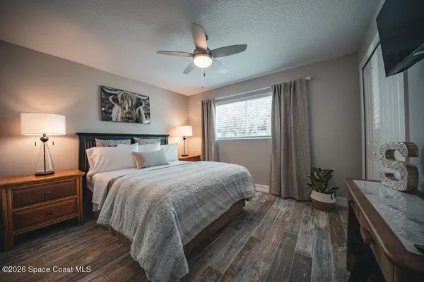 a bedroom with a bed and a dresser