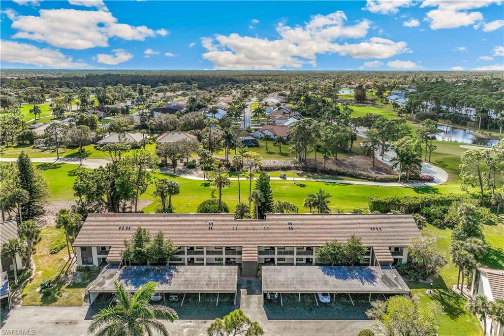 5841 Rattlesnake Hamm Road, Unit I101 Naples, FL 34113 - Photo 2 of 17 Aerial view of front of the unit building overlooking the golf course