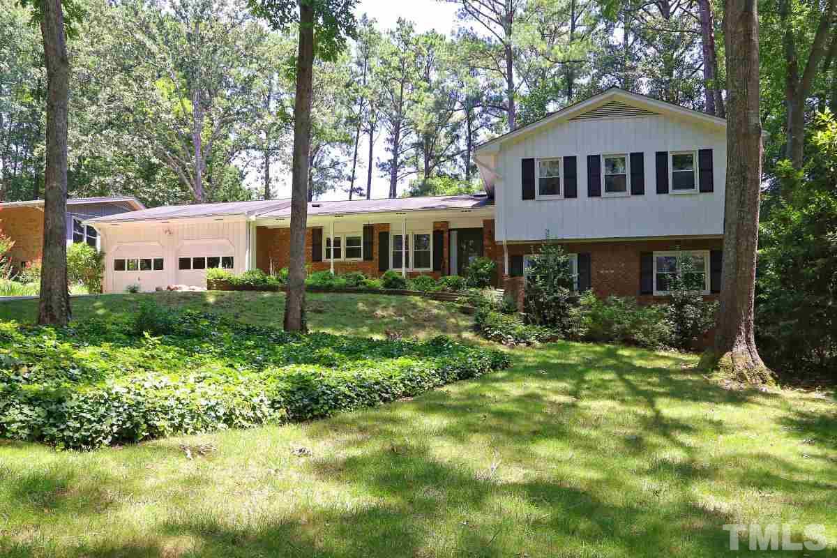 4508 Oak Park Road Raleigh, NC 27612 - Photo 1 of 24 a front view of a house with a yard