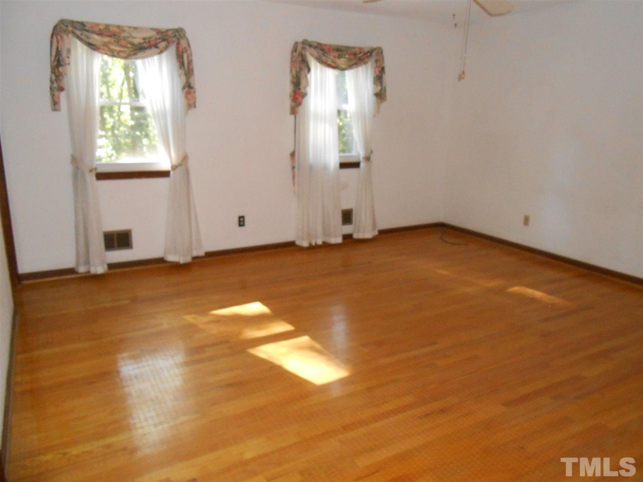 4508 Oak Park Road Raleigh, NC 27612 - Photo 11 of 24 an empty room with windows