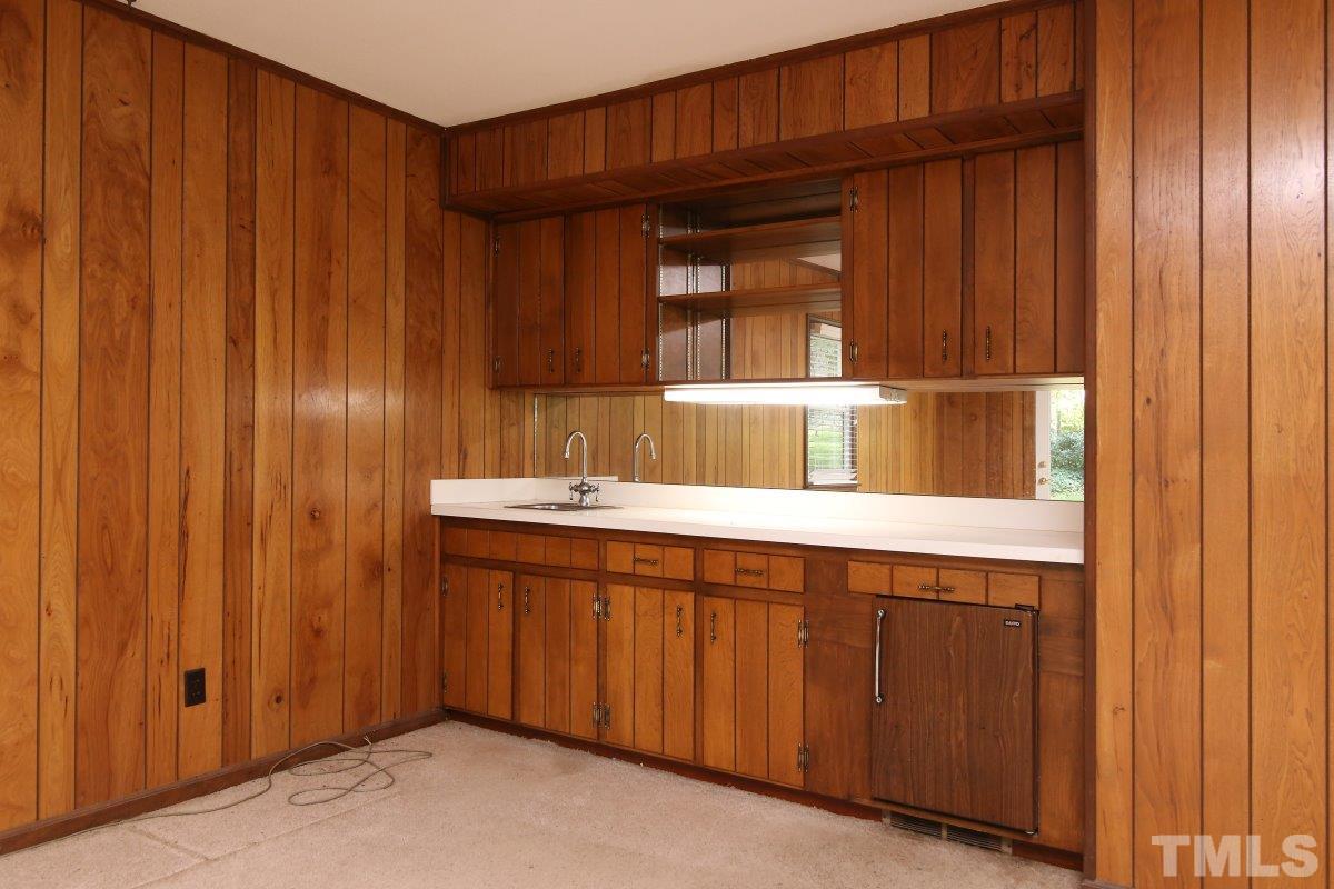 4508 Oak Park Road Raleigh, NC 27612 - Photo 14 of 24 a bathroom with a sink and a mirror