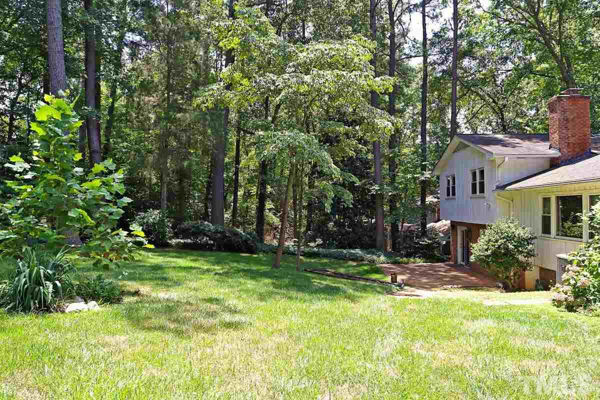 4508 Oak Park Road Raleigh, NC 27612 - Photo 23 of 24 a view of a house with a yard