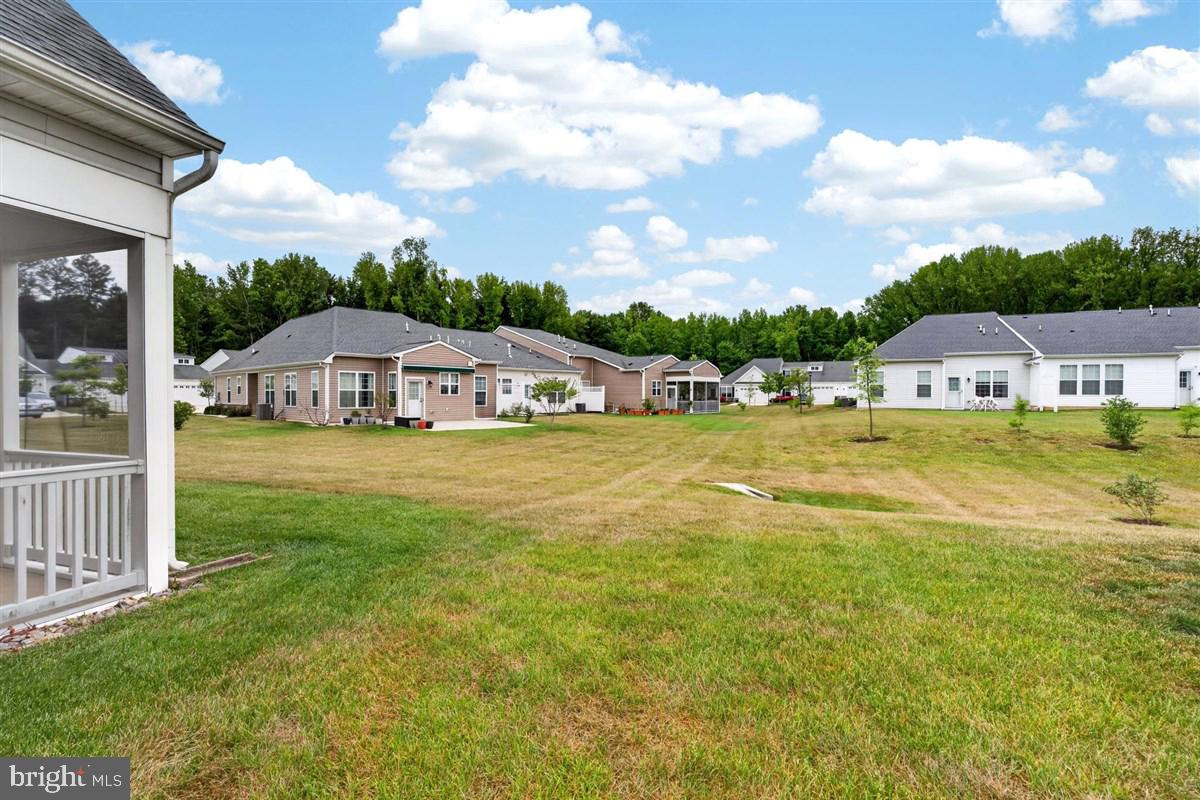 1426 Whispering Woods Road Middletown, DE 19709 - Photo 32 of 37 a view of a house with a big yard