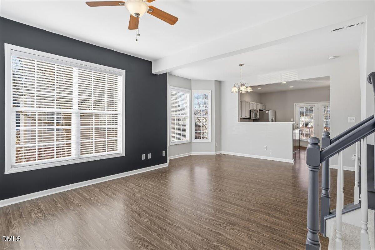 5531 Crabtree Park Court Raleigh, NC 27612 - Photo 15 of 41 a view of an empty room with wooden floor and a window