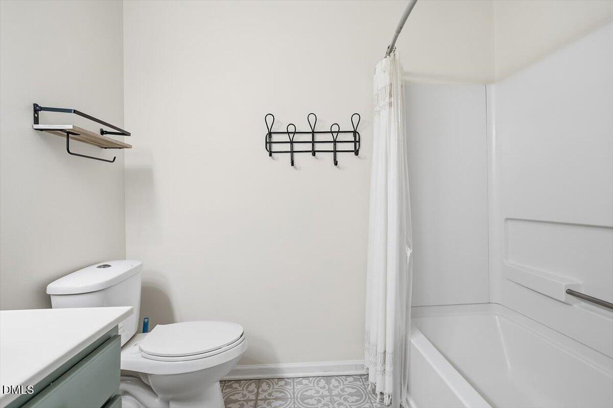 5531 Crabtree Park Court Raleigh, NC 27612 - Photo 23 of 41 a bathroom with a shower and toilet