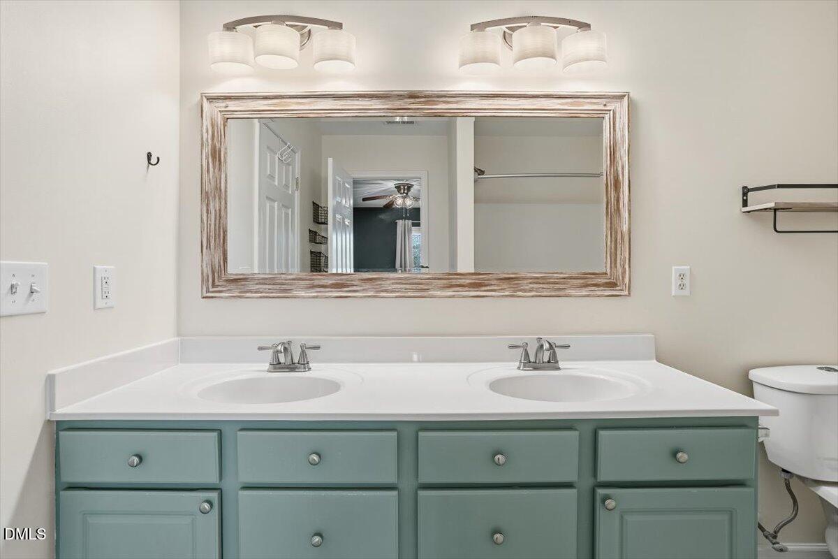 5531 Crabtree Park Court Raleigh, NC 27612 - Photo 24 of 41 a bathroom with a sink and two mirror
