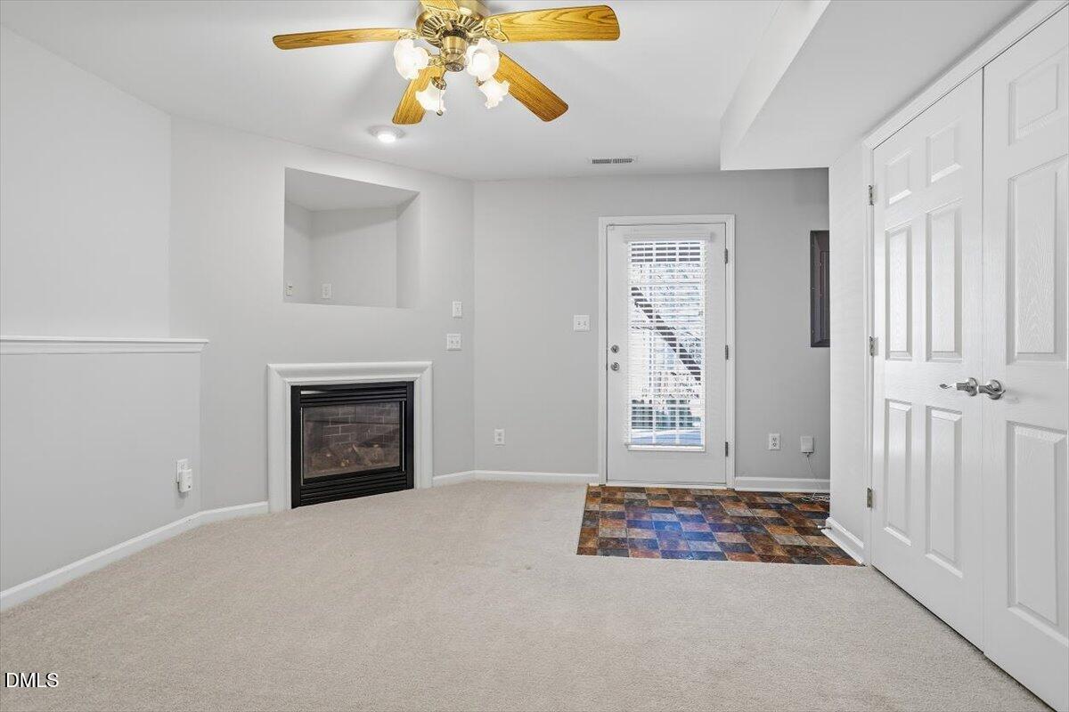 5531 Crabtree Park Court Raleigh, NC 27612 - Photo 30 of 41 an empty room with windows and fireplace