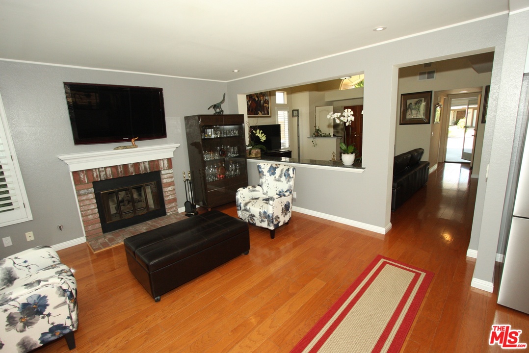 553 Fairfield Road Simi Valley, CA 93065 - Photo 11 of 49 a living room with furniture and a flat screen tv