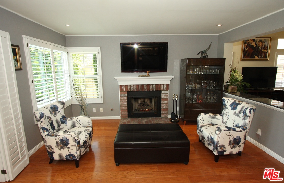 553 Fairfield Road Simi Valley, CA 93065 - Photo 13 of 49 a living room with furniture fireplace and flat screen tv