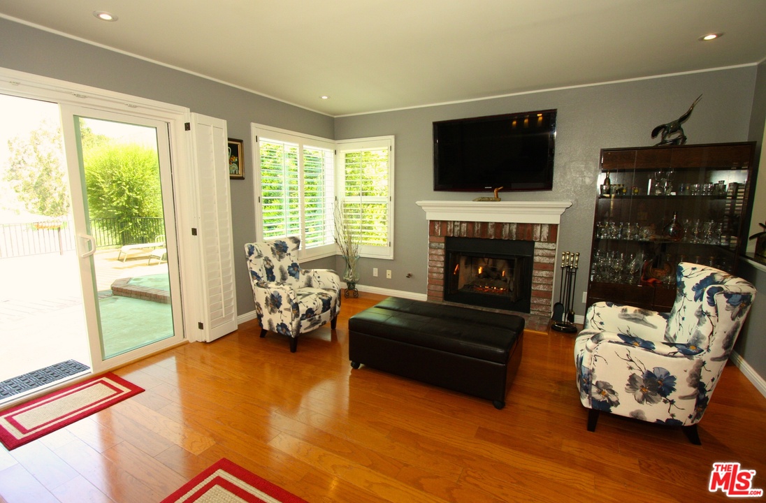 553 Fairfield Road Simi Valley, CA 93065 - Photo 15 of 49 a living room with furniture and a fireplace