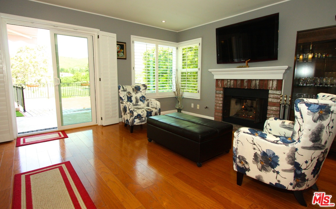553 Fairfield Road Simi Valley, CA 93065 - Photo 17 of 49 a living room with furniture fireplace and flat screen tv