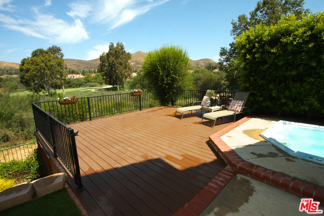 553 Fairfield Road Simi Valley, CA 93065 - Photo 31 of 49 a view of swimming pool with lounge chair and dinning table under an umbrella