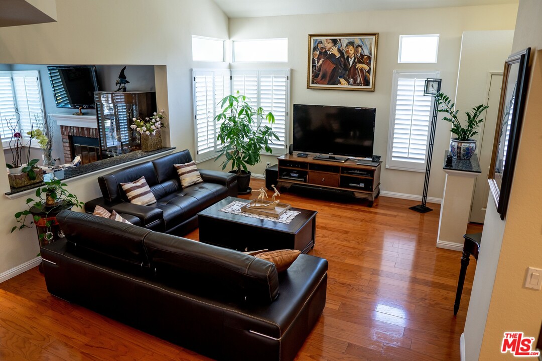 553 Fairfield Road Simi Valley, CA 93065 - Photo 5 of 49 a living room with furniture and a flat screen tv