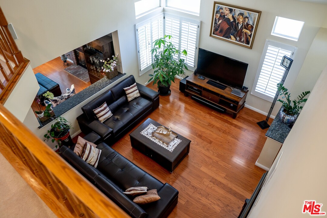 553 Fairfield Road Simi Valley, CA 93065 - Photo 6 of 49 a living room with furniture and a flat screen tv