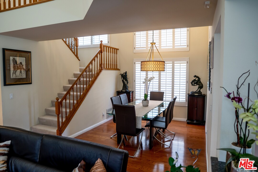 553 Fairfield Road Simi Valley, CA 93065 - Photo 7 of 49 a view of a dining room with furniture and wooden floor