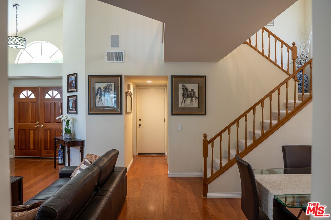553 Fairfield Road Simi Valley, CA 93065 - Photo 10 of 49 a livingroom with furniture stairs and a flat screen tv