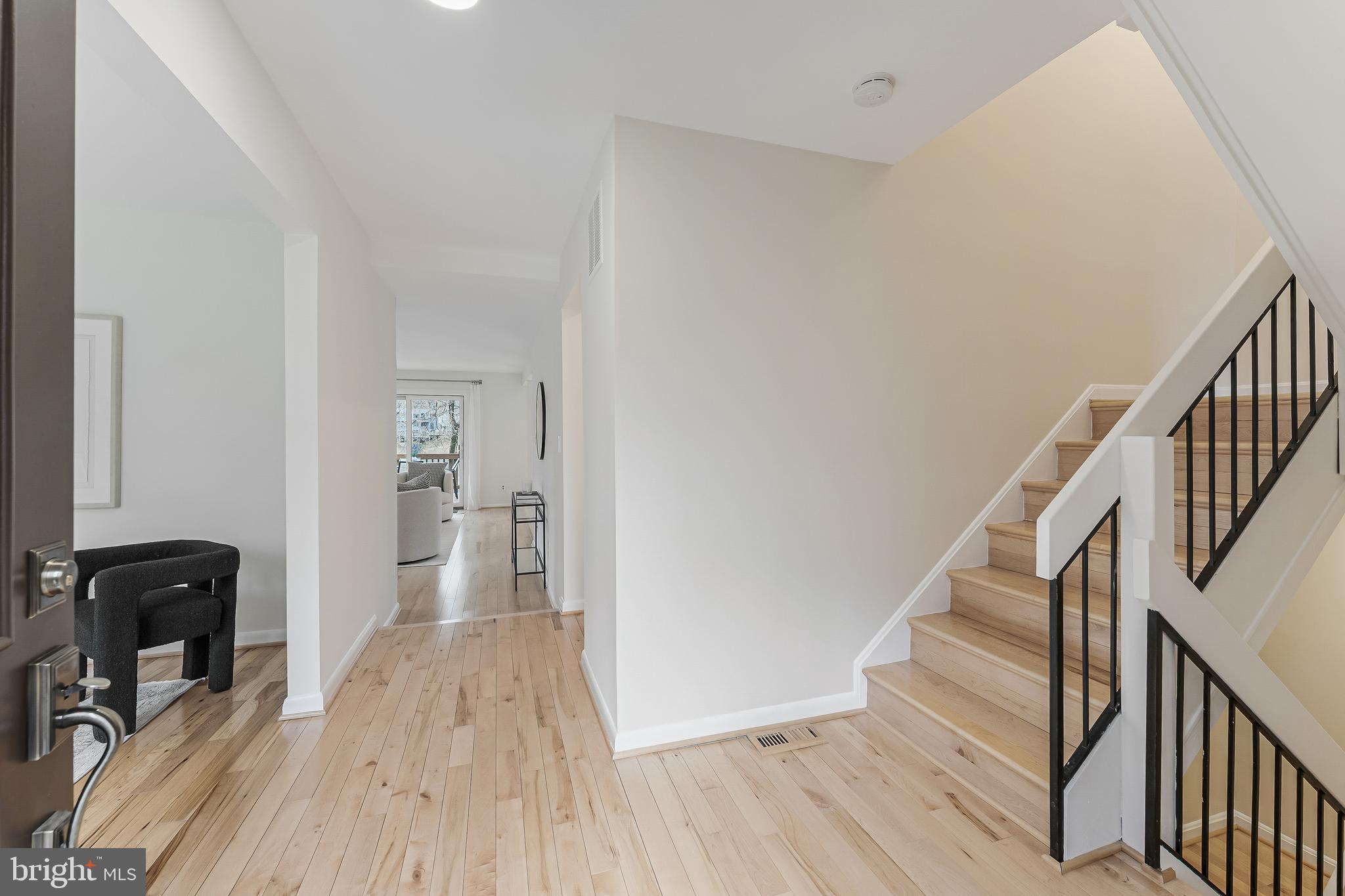 2261 Cedar Cove Court Reston, VA 20191 - Photo 15 of 102 a view of a hallway with wooden floor and staircase