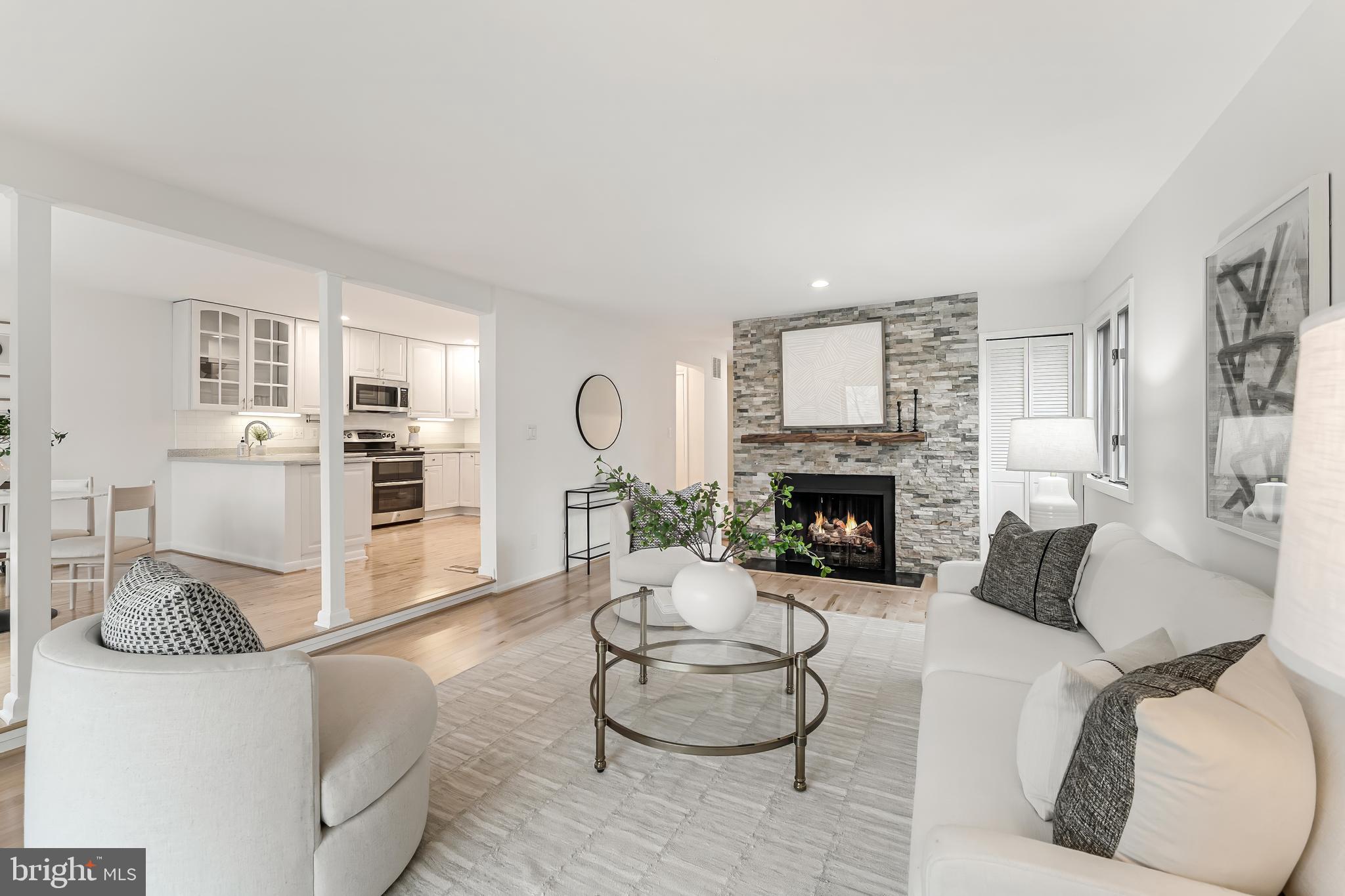 2261 Cedar Cove Court Reston, VA 20191 - Photo 21 of 102 a living room with furniture and a fireplace