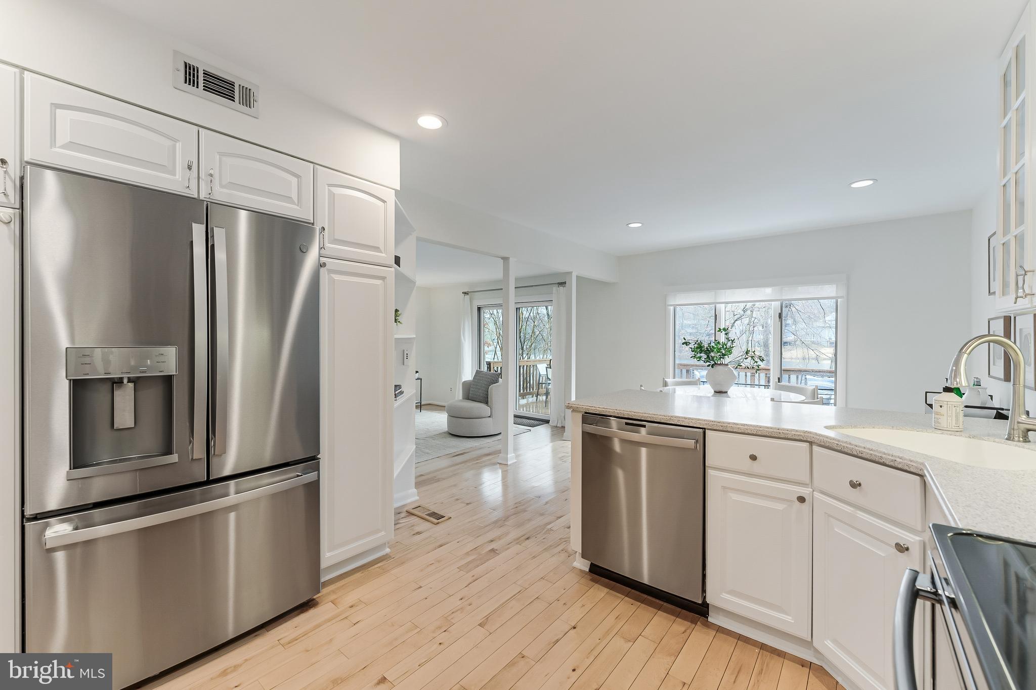 2261 Cedar Cove Court Reston, VA 20191 - Photo 29 of 102 a kitchen with stainless steel appliances a refrigerator sink and cabinets
